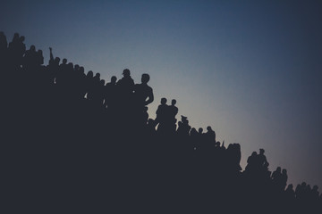 Silhouettes of people on the mountain