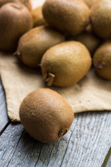 Juicy kiwi fruit on wooden background, room for text. selective focus 