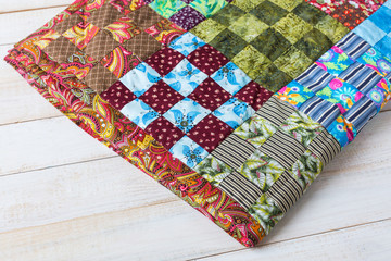 arts and crafts, handmade, sewing, quilting, interior, cosiness, culture, applique concept - colorful textile work made of bright rags in popular american technique patchwork