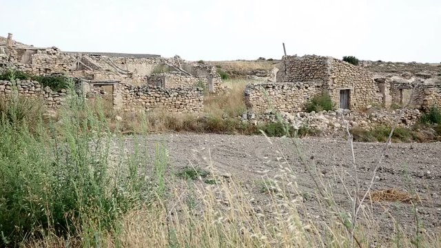 ruins of abandoned rustic houses made of stone next to Borja, province of Zaragoza, Spain