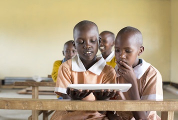 School girls using tablet computer in the classroom