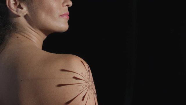  Graphic animation projected onto the arm of female model given injection