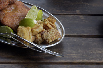 Fried pork steak and crackers, side dishes of feijoada