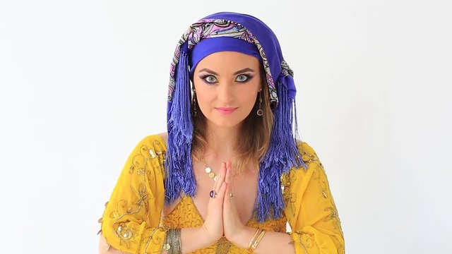 Clouse up of beautiful girl in arabian style and make up in white backgraund 
