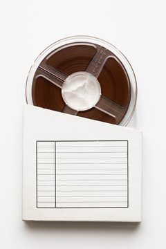 Tape reel emerging from box