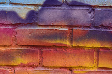 Red, Yellow, and Blue Brick Wall Texture Background