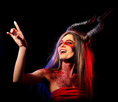Mad satan woman on black magic ritual of hell. Witch reincarnation mythical creature Sabbath. Devil absorbing soul Halloween Astral beings are among us Make-up for night club for demon inflicts damage