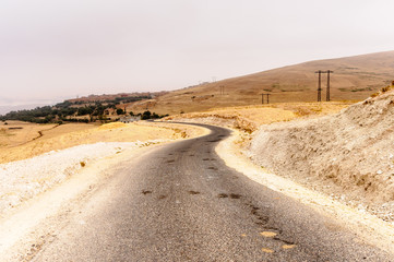 Tarmaced road through the Western Sahara desert on an overcast day, Souss-Massa-Dr&acirc;a region of the Sahara Desert, Morocco