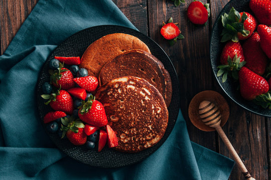 Pancakes with strawberries and blueberries