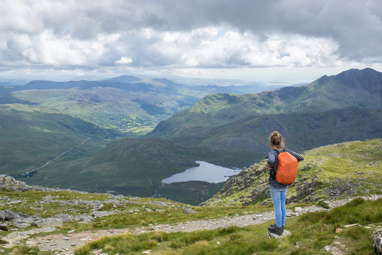 Female hiker in rugged mountains.
