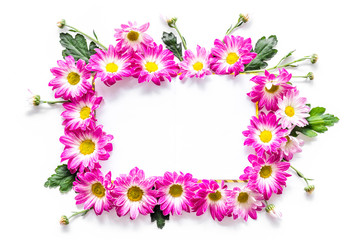 Floral mockup. Sheet of paper in frame of pink flowers on white background top view