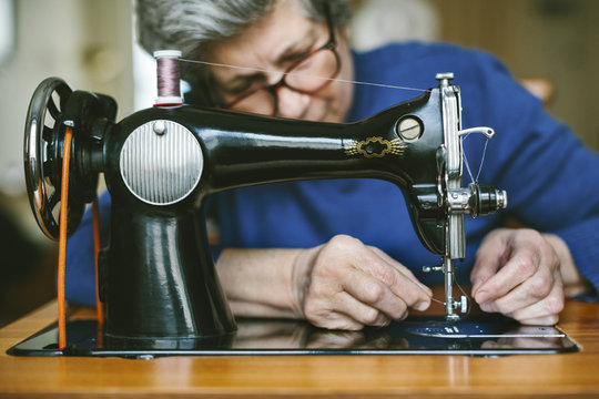 Senior woman working on a sewing machine