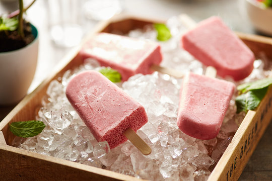 Strawberry popsicle on ice basket