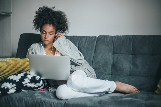 Woman working at home with her computer