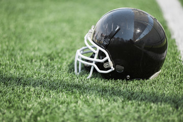 American football helmet on the grass