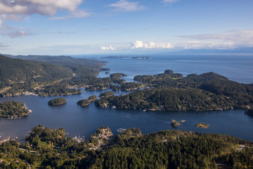 Fototapeta na wymiar Pender Harbour in Sunshine Coast, British Columbia, Canada, during a cloudy evening from an Aerial View.