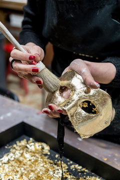 Woman making venetian mask on a workshop