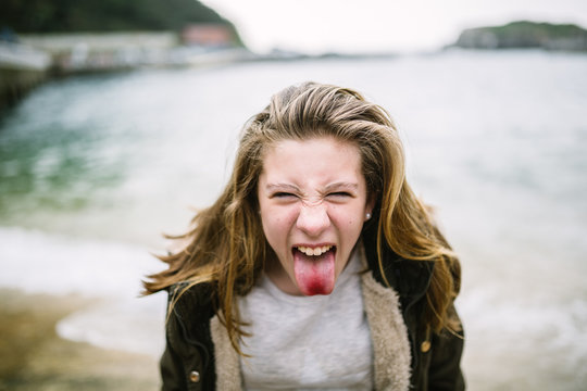 Teenager Sticking Out Tongue