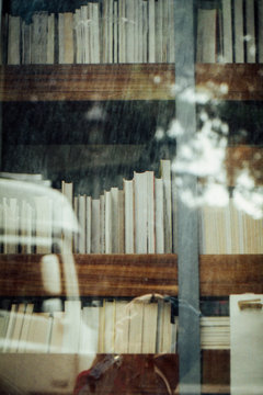 Bookshelves through glass window