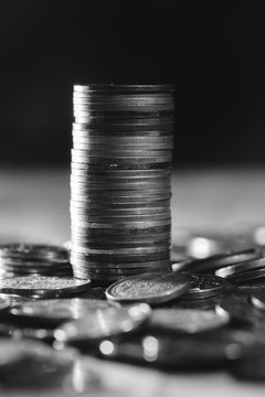 Close up of Stack of coins in black and white.