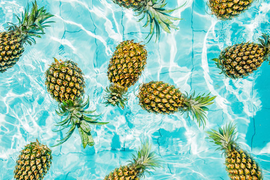 Pineapples in a swimming pool.