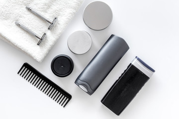 Shampoo and shower gel for men on white background top view