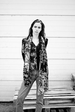 Black and white photo of a girl in interesting pattern clothes