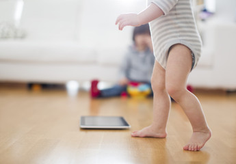 1 year old boy make his first step