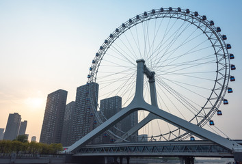 Obraz premium big ferris wheel and tianjin urban skyline,china.