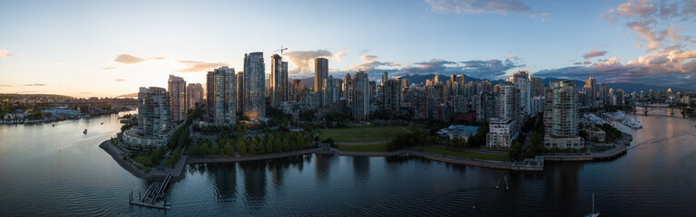 Fototapeta na wymiar Aerial Panorama of Downtown City at False Creek, Vancouver, British Columbia, Canada. Taken during a bright sunset.