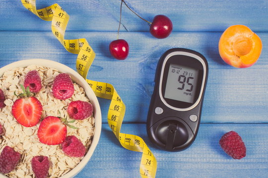Glucose meter, oatmeal with fruits and centimeter, concept of checking sugar level, diabetes and healthy lifestyle