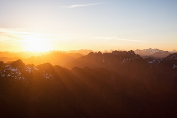 Beautiful rugged mountain landscape view during a golden sunset. Taken near Tofino, Vancouver Island, British Columbia, Canada.