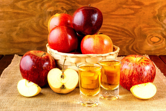 Schnapps drinks and apples in the wicker basket