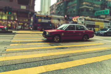 taxi on city street,hong kong,china,asia.