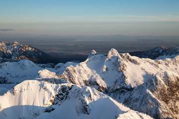 Obraz premium Aerial landscape view of The Lions Peak. Picture taken on the North Shore Vancouver Mountains, BC, Canada.