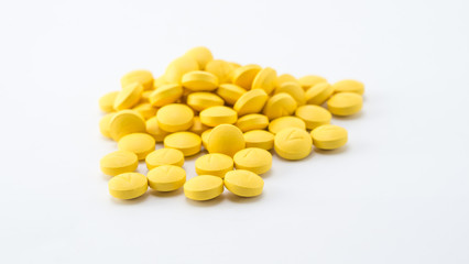 yellow tablets stack on white background