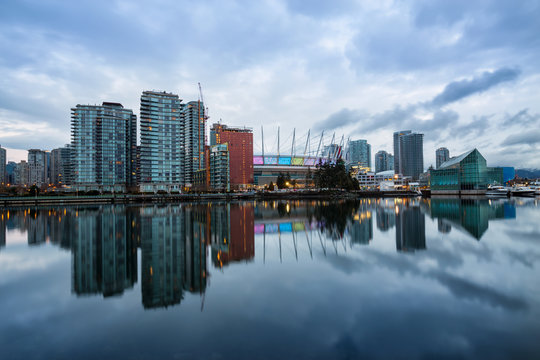 Beautiful cloudy morning sunrise with the view of False Creek in Downtown Vancouver, British Columbia, Canada.
