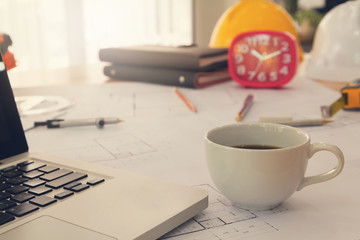 Architect concept, Architects office in working hours with coffee cup and blueprints, Vintage Effect