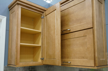 Wood kitchen cabinet with door open