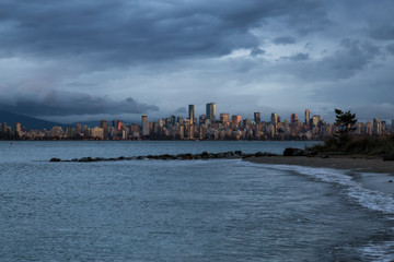 Vancouver Downtown, BC, Canada, viewed from Jericho Beach during storm weather and high water levels.