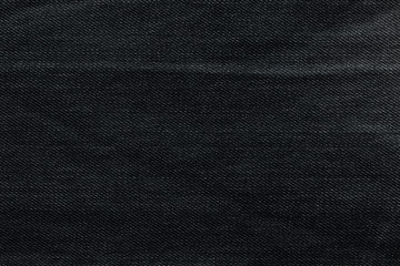 Fototapeta premium Black background, denim jeans background. Jeans texture, fabric.