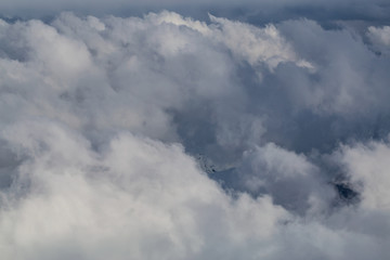 Aerial view of the Top of the Clouds. Perfect for Background Use. Taken from an airplane in British Columbia, Canada.