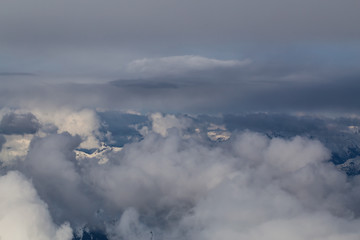 Obraz premium Aerial view of the Top of the Clouds. Perfect for Background Use. Taken from an airplane in British Columbia, Canada.