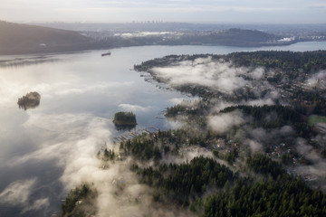 Beautiful view on the luxury homes in Deep Cove, Greater Vancouver, British Columbia, Canada. Taken during a cloudy early morning from an aerial perspective.