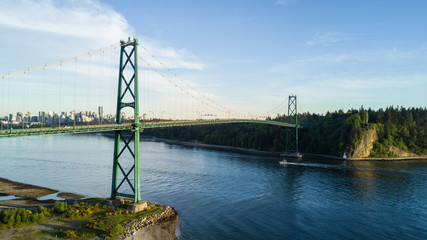 Aerial view of Lions Gate Bridge, Stanley Park and Downtown City in the background. Taken in Vancouver, British Columbia, Canada.