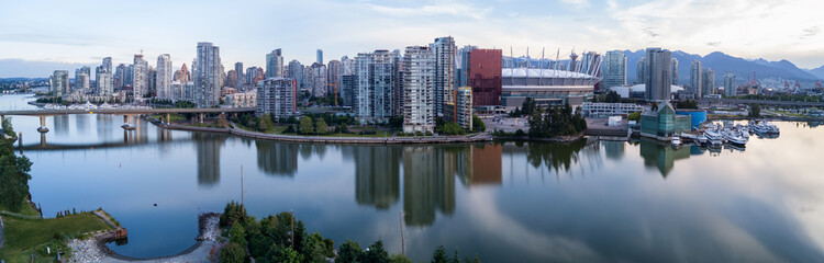 Fototapeta na wymiar Panoramic City Skyline View of Downtown Vancouver around False Creek area from an Aerial Perspective. Taken in British Columbia, Canada, durin a colorful sunrise.