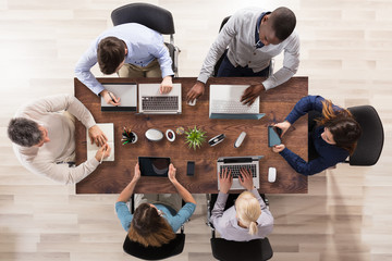 Group Of Businesspeople Working In Office