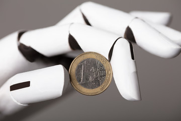 Robotic Hand Showing One Euro Coin