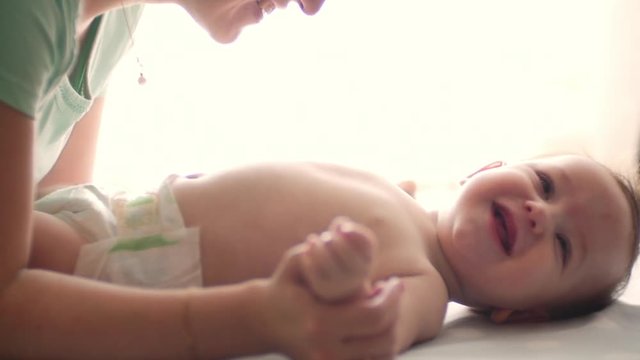 Mother kissing her child slow motion 