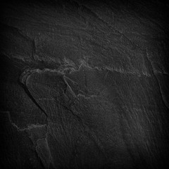 Dark grey black slate background or texture.